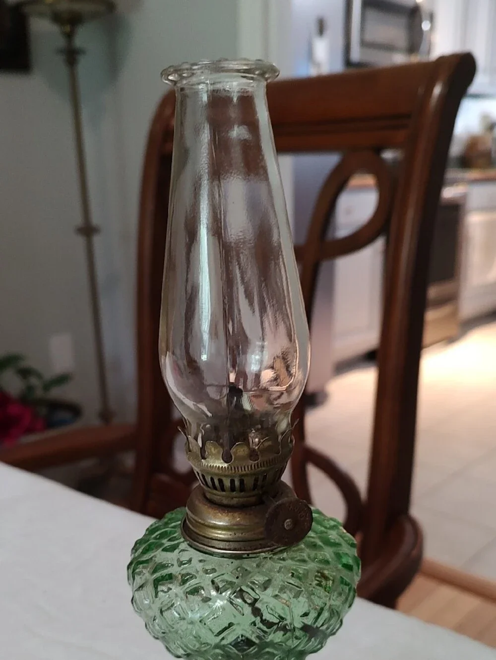 Vintage Small Oil Lamp With Clear Globe And Green Center With Brass Bass.